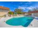 Refreshing community pool with surrounding lounge chairs at 7133 Cedar Hollow Cir # 22-102, Bradenton, FL 34203