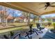 Relaxing screened porch with patio furniture and view of the community at 7133 Cedar Hollow Cir # 22-102, Bradenton, FL 34203