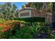 Stonehaven community sign surrounded by manicured landscaping and vibrant flowers at 7911 Moonstone Dr # 26-203, Sarasota, FL 34233
