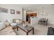 Inviting living room flowing into a modern kitchen and dining area, perfect for entertaining at 7911 Moonstone Dr # 26-203, Sarasota, FL 34233