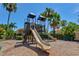 Community playground with slides and climbing structures, set amongst lush landscaping at 7911 Moonstone Dr # 26-203, Sarasota, FL 34233