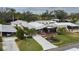 Single wide home in a community setting with lush landscaping at 8520 Imperial Cir, Palmetto, FL 34221