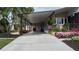 Covered carport with well-maintained landscaping and home exterior at 8520 Imperial Cir, Palmetto, FL 34221