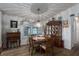 Dining area with round table, wooden hutch, and stained glass lamp at 8520 Imperial Cir, Palmetto, FL 34221