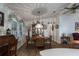Round dining table with four chairs, and a china cabinet at 8520 Imperial Cir, Palmetto, FL 34221