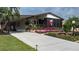 Well-maintained manufactured home with attractive landscaping at 8520 Imperial Cir, Palmetto, FL 34221