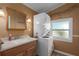 Laundry room with stackable washer/dryer at 8520 Imperial Cir, Palmetto, FL 34221