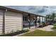 Side view of the home showcasing additional details and landscaping at 8520 Imperial Cir, Palmetto, FL 34221