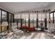 Bright sunroom with comfy seating and view at 8520 Imperial Cir, Palmetto, FL 34221