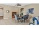 Bright dining room with a wooden table, gray chairs, and stylish decor at 9214 Raes Creek Pl, Palmetto, FL 34221