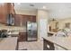 The kitchen features granite countertops, stainless steel appliances and an open concept design at 9214 Raes Creek Pl, Palmetto, FL 34221