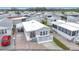 Aerial view of a mobile home community, featuring a single-wide mobile home with a carport and deck at 3333 26Th E Ave # 1120, Bradenton, FL 34208