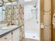 Clean bathroom with walk-in shower, grab bar, and floral shower curtain at 3333 26Th E Ave # 1120, Bradenton, FL 34208