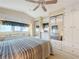 Main bedroom with mirrored closet doors and ceiling fan at 3333 26Th E Ave # 1120, Bradenton, FL 34208