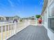 Gray composite deck with white railing overlooking the mobile home community at 3333 26Th E Ave # 1120, Bradenton, FL 34208