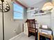 Bright home office features a desk, chair, printer, and ample shelving at 3333 26Th E Ave # 1120, Bradenton, FL 34208