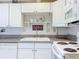Clean and bright kitchen with white cabinetry and appliances at 3333 26Th E Ave # 1120, Bradenton, FL 34208