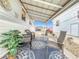 Relaxing patio with covered seating area, wicker chairs, and rug at 3333 26Th E Ave # 1120, Bradenton, FL 34208
