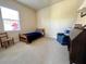 Charming bedroom with a single bed and a comfortable armchair at 7709 River Preserve Dr, Bradenton, FL 34212