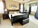 Spacious main bedroom with a king-size bed and sitting area at 7709 River Preserve Dr, Bradenton, FL 34212