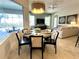 Casual breakfast nook with table and chairs, overlooks the pool at 7709 River Preserve Dr, Bradenton, FL 34212