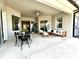 Relaxing covered patio with seating and dining areas at 7709 River Preserve Dr, Bradenton, FL 34212
