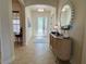 Inviting entryway with tile flooring and a stylish console table at 7709 River Preserve Dr, Bradenton, FL 34212
