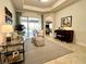 Bright and airy living room features a comfortable seating area and a view to the backyard at 7709 River Preserve Dr, Bradenton, FL 34212