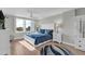 Spacious bedroom with a king-size bed, white furniture, and water views at 101 S Gulfstream Ave # 4F, Sarasota, FL 34236