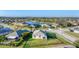 Aerial view of home with a fenced in backyard and a lake view at 10817 56Th St E, Parrish, FL 34219