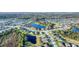 Aerial view of a suburban neighborhood with ponds running throughout the community at 10817 56Th St E, Parrish, FL 34219