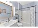 Bathroom features a shower and tub, with a modern vanity and white walls at 10817 56Th St E, Parrish, FL 34219