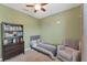 Charming bedroom featuring a comfortable bed, stylish bookshelf and cozy chair at 10817 56Th St E, Parrish, FL 34219