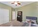 Well-lit bedroom with a large window, spacious closet, and neutral decor at 10817 56Th St E, Parrish, FL 34219