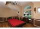 Billiard room featuring a red pool table, wainscotting, a decorative chandelier, and natural light at 10817 56Th St E, Parrish, FL 34219