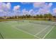 A view of the community tennis courts on a sunny day with blue skies and white clouds at 10817 56Th St E, Parrish, FL 34219