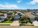 Aerial view of houses with gray roofs and green lawns at 10931 Blue Magnolia Ln, Parrish, FL 34219