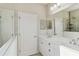 Elegant bathroom featuring double vanity and a large mirror at 10931 Blue Magnolia Ln, Parrish, FL 34219