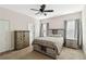 Well-lit bedroom with ceiling fan and neutral decor at 10931 Blue Magnolia Ln, Parrish, FL 34219