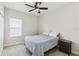 Cozy bedroom with window blinds and a nightstand at 10931 Blue Magnolia Ln, Parrish, FL 34219