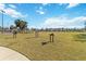 Large grassy field with musical instruments and directional signage at 10931 Blue Magnolia Ln, Parrish, FL 34219