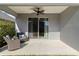 Covered patio with ceiling fan and seating area at 10931 Blue Magnolia Ln, Parrish, FL 34219