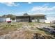 Home backyard featuring a screened lanai and white privacy fence at 1119 76Th Nw St, Bradenton, FL 34209