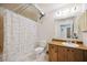 Bathroom with shower/tub combo, vanity, and linen closet at 1119 76Th Nw St, Bradenton, FL 34209