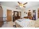 Bedroom featuring a double bed, dresser and large window at 1119 76Th Nw St, Bradenton, FL 34209