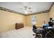 Bedroom with beige walls, tile floor, ceiling fan and natural light at 1119 76Th Nw St, Bradenton, FL 34209