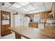 Galley kitchen with wood cabinets and white appliances at 1119 76Th Nw St, Bradenton, FL 34209