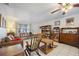 Inviting living room features tile flooring, a ceiling fan, and classic wooden furniture at 1119 76Th Nw St, Bradenton, FL 34209