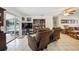 Open living room showcasing a sliding glass door, television, and comfortable leather seating at 1119 76Th Nw St, Bradenton, FL 34209