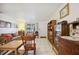 Living room with tiled floors, rocking chairs, and built-in shelving at 1119 76Th Nw St, Bradenton, FL 34209